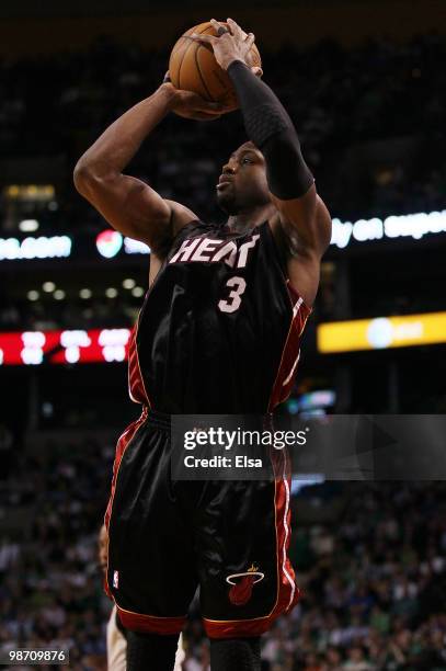 Dwyane Wade of the Miami Heat shoots a three point shot in the second half against the Boston Celtics during Game Five of the Eastern Conference...