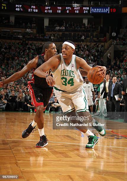 Paul Pierce of the Boston Celtics drives against Mario Chalmers of the Miami Heat in Game Five of the Eastern Conference Quarterfinals during the...