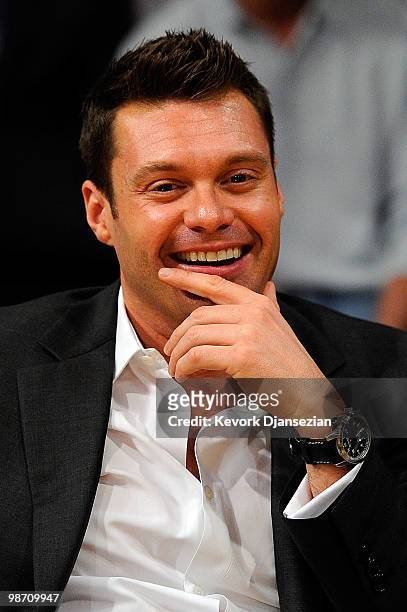 Personality Ryan Seacrest smiles before the start of Game Two of the Western Conference Quarterfinals of the 2010 NBA Playoffs between the Los...