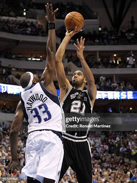 Forward Tim Duncan of the San Antonio Spurs takes a shot against Brendan Haywood of the Dallas Mavericks in Game Five of the Western Conference...