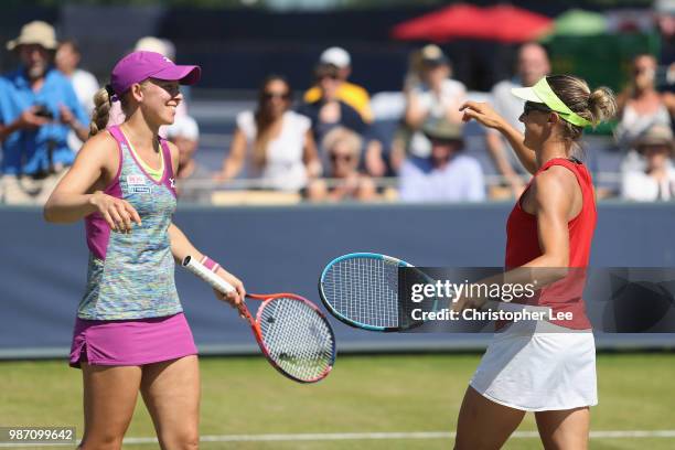 Kirsten Flipkens of Belgium and Johanna Larsson of Sweden celebrate their victory after they beat Alicja Rosolska of Poland and Abigail Spears of USA...