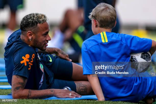 Neymar Jr talks to his son Davi Lucca da Silva Santos during a Brazil training session on June 29, 2018 in Sochi, Russia.
