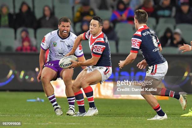 Cooper Cronk of the Roosters passes the ball during the round 16 NRL match between the Sydney Roosters and the Melbourne Storm at Adelaide Oval on...