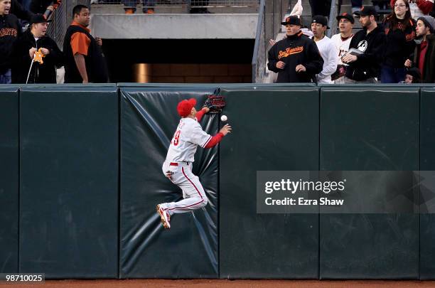 Raul Ibanez of the Philadelphia Phillies can't catch a ball hit by Nate Schierholtz of the San Francisco Giants at AT&T Park on April 27, 2010 in San...