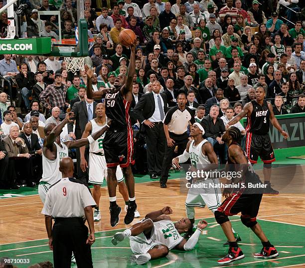 Joel Anthony of the Miami Heat shoots against Kevin Garnett of the Boston Celtics in Game Five of the Eastern Conference Quarterfinals during the...