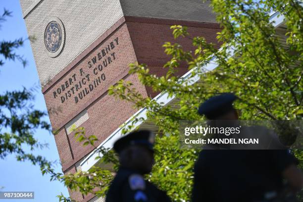 Police are seen outside the Robert F. Sweeney District Court in Annapolis, Maryland, on June 29 where suspected shooter Jarrod Ramos is expected to...