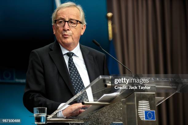 President of the European Commission Jean-Claude Juncker looks on as he gives a joint press conference with the European Council President and...