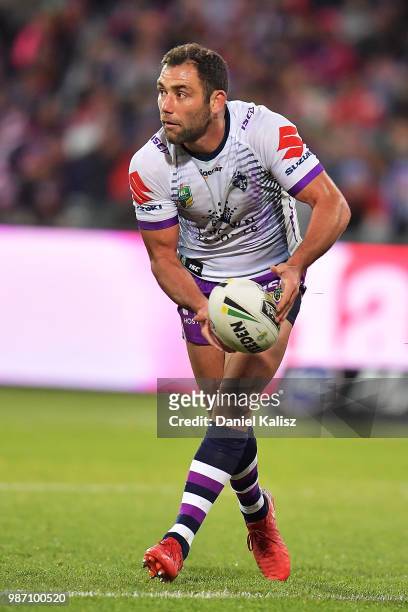 Cameron Smith of the Storm passes the ball during the round 16 NRL match between the Sydney Roosters and the Melbourne Storm at Adelaide Oval on June...