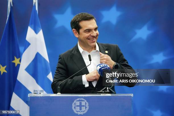 Greece's Prime Minister Alexis Tsipras gives a press conference on the sidelines of the European Union leaders' summit, without Britain, to discuss...