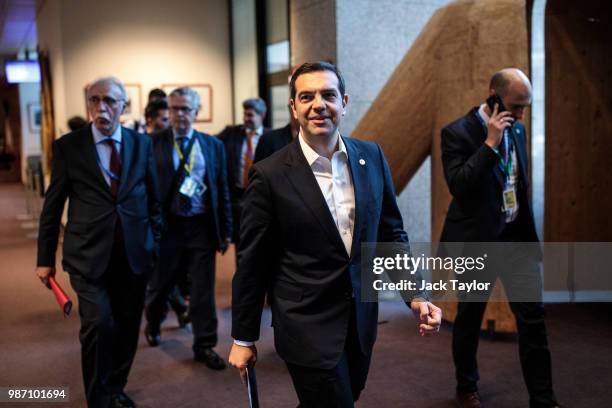 Prime Minister of Greece Alexis Tsipras makes his way to give a press conference on the final day of the European Council leaders' summit on June 29,...