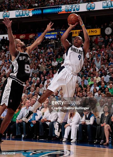 Caron Butler of the Dallas Mavericks shoots the fall away jumper against Tim Duncan of the San Antonio Spurs in Game Five of the Western Conference...