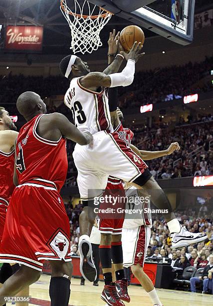LeBron James of the Cleveland Cavaliers gets a shot off after getting around Luol Deng of the Chicago Bulls in Game Five of the Eastern Conference...