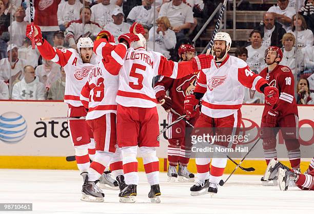 Henrik Zetterberg and Todd Bertuzzi of the Detroit Red Wings celebrate with teammates after a goal against the Phoenix Coyotes in Game Seven of the...