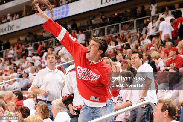 Detroit Red Wings fan throws an octopus on the ice during third period play against the Phoenix Coyotes in Game Seven of the Western Conference...