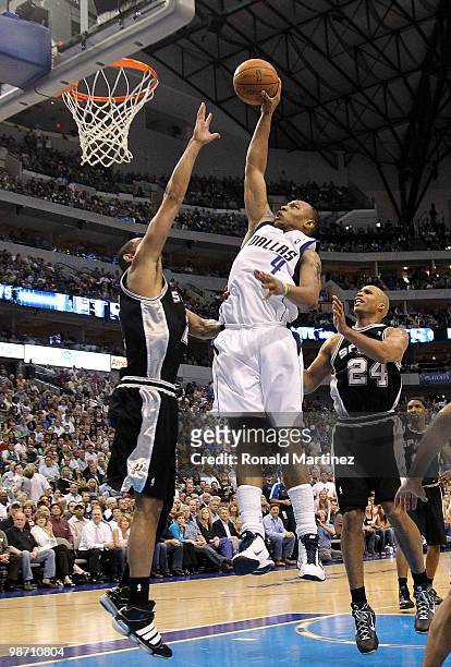 Forward Caron Butler of the Dallas Mavericks drives the hoop against Tim Duncan of the San Antonio Spurs in Game Five of the Western Conference...