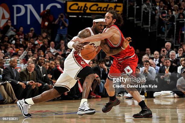 LeBron James of the Cleveland Cavaliers drives around the perimeter against Joakim Noah of the Chicago Bulls in Game Five of the Eastern Conference...