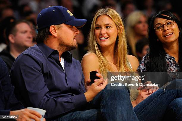 Actor Leonardo DiCaprio and girlfriend model Bar Refaeli sit courtside during Game Two of the Western Conference Quarterfinals of the 2010 NBA...