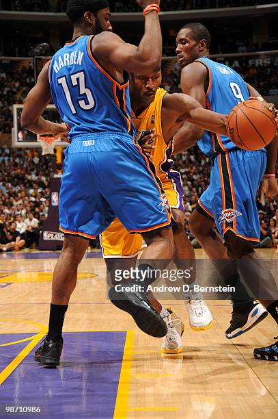 Ron Artest of the Los Angeles Lakers makes his way to the basket against James Harden and Serge Ibaka of the Oklahoma City Thunder in Game Five of...