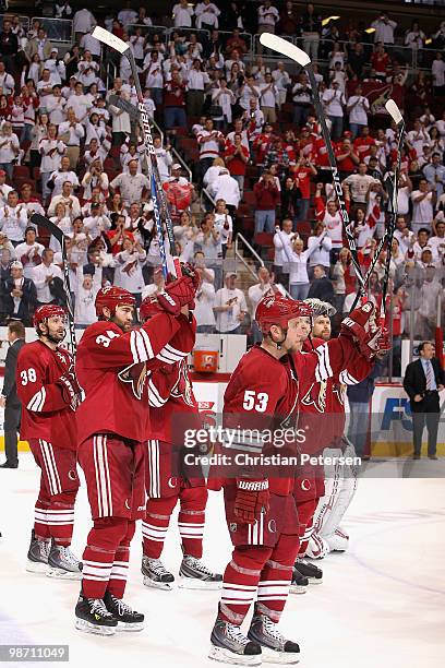 Vernon Fiddler, Daniel Winnik, Derek Morris and Ilya Bryzgalov of the Phoenix Coyotes salute the fans following Game Seven of the Western Conference...