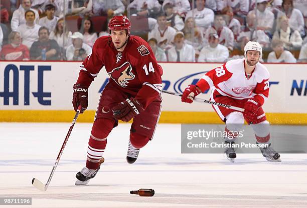 Taylor Pyatt of the Phoenix Coyotes skates past a bottle thrown on the ice in Game Seven of the Western Conference Quarterfinals against the Detroit...