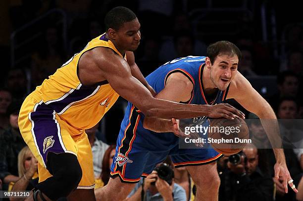 Andrew Bynum of the Los Angeles Lakers and Nenad Krstic of the Oklahoma City Thunder battle for the ball in the third period during Game Five of the...
