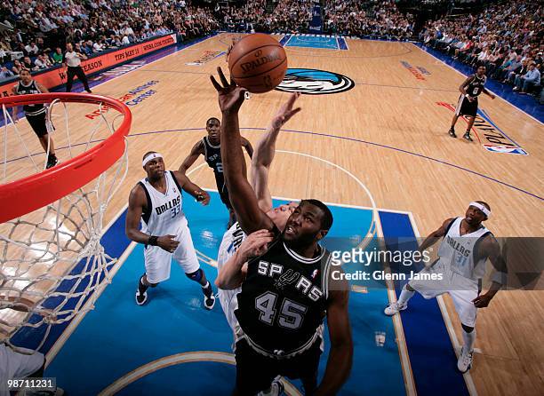 DeJuan Blair of the San Antonio Spurs goes up for the rebound against Eduardo Najera of the Dallas Mavericks in Game Five of the Western Conference...