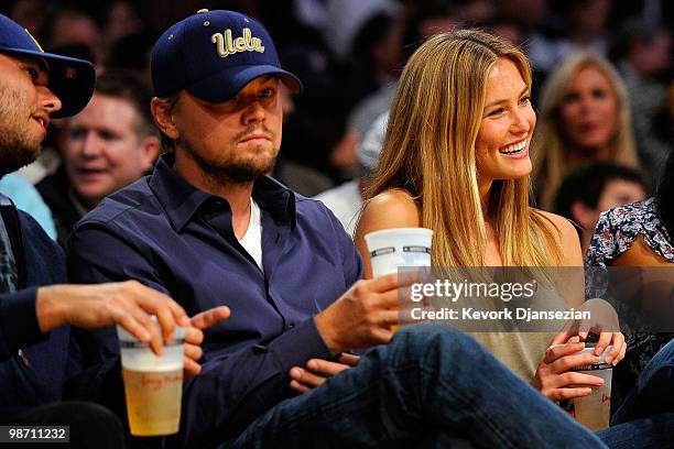 Actor Leonardo DiCaprio and girlfriend model Bar Refaeli sit courtside during Game Two of the Western Conference Quarterfinals of the 2010 NBA...