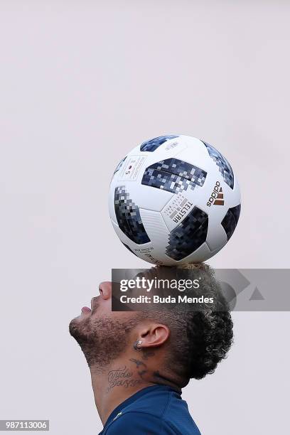 Neymar Jr balances the ball on his head during a Brazil training session on June 29, 2018 in Sochi, Russia.