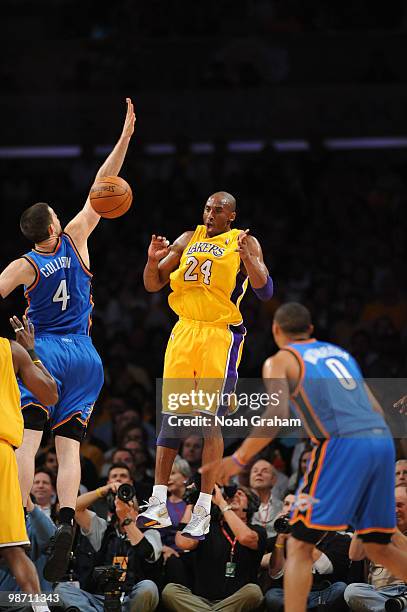 Kobe Bryant of the Los Angeles Lakers passes against Nick Collison of the Oklahoma City Thunder in Game Five of the Western Conference Quarterfinals...