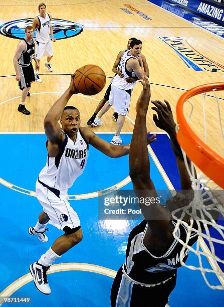 Forward Caron Butler of the Dallas Mavericks takes a shot against Ian Mahinmi of the San Antonio Spurs in Game Five of the Western Conference...