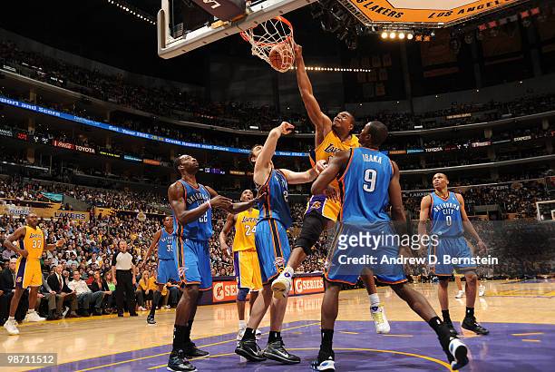 Andrew Bynum of the Los Angeles Lakers dunks against Serge Ibaka of the Oklahoma City Thunder in Game Five of the Western Conference Quarterfinals...