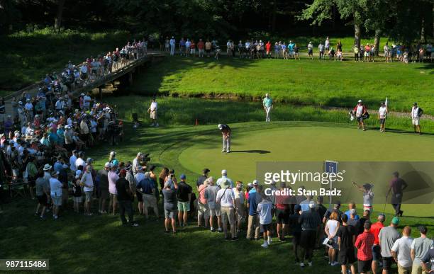 Marc Leishman of Australia hits a putt on the 11th hole during the second round of the Quicken Loans National at TPC Potomac at Avenel Farm on June...