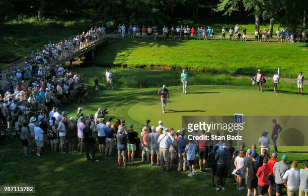 Marc Leishman of Australia acknowledges the gallery on the 11th hole during the second round of the Quicken Loans National at TPC Potomac at Avenel...