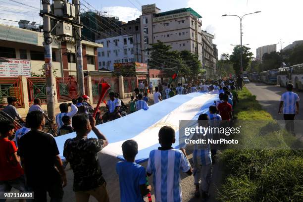 Bangladeshi football fans of Argentina waves the national flag of Argentina as they take part in rally ahead of France vs Argentina match in the FIFA...