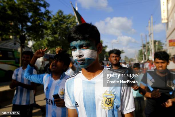 Bangladeshi football fans of Argentina waves the national flag of Argentina as they take part in rally ahead of France vs Argentina match in the FIFA...