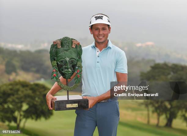 Ben Poland of the United States with the official trophy during the final round of the PGA TOUR Latinoamérica Guatemala Stella Artois Open at La...