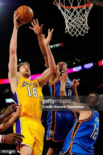 Pau Gasol of the Los Angeles Lakers goes up for a shot against Russell Westbrook and Nenad Krstic of the Oklahoma City Thunder in the second half...