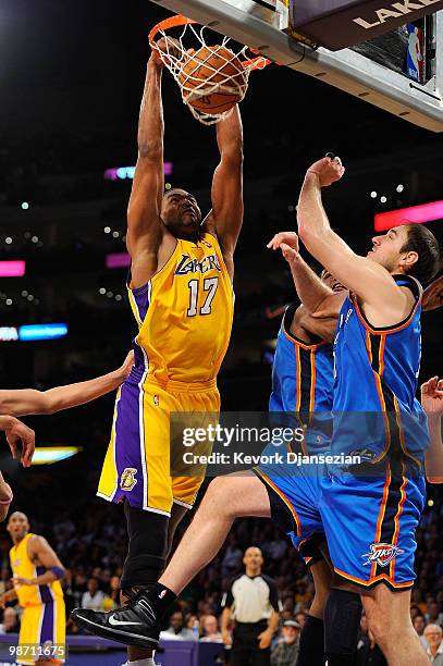 Andrew Bynum of the Los Angeles Lakers dunks the ball over Nenad Krstic of the Oklahoma City Thunder in the second half during Game Five of the...