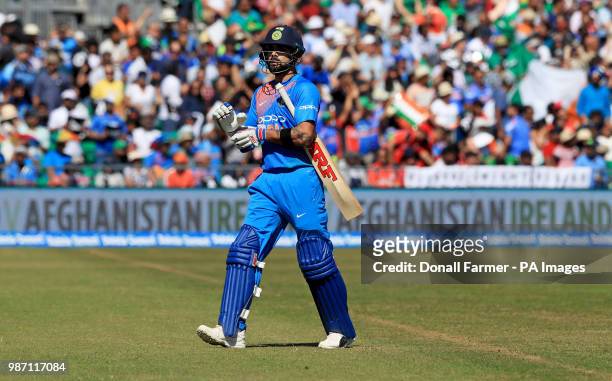 Virat Kohli of India leaves the pitch after being caught by George Dockrell of Ireland during the Second International Twenty20 Match at Malahide,...