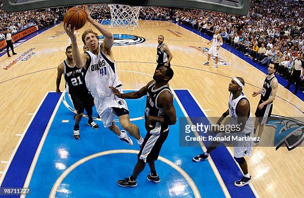 Forward Dirk Nowitzki of the Dallas Mavericks takes a shot against Antonio McDyess of the San Antonio Spurs in Game Five of the Western Conference...