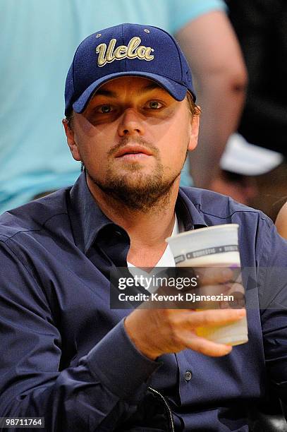 Actor Leonardo DiCaprio sits courtside during Game Five of the Western Conference Quarterfinals of the 2010 NBA Playoffs between the Los Angeles...