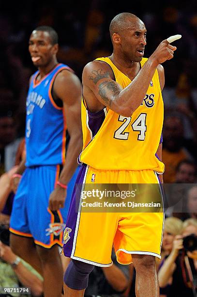 Kobe Bryant of the Los Angeles Lakers reacts alongside Serge Ibaka of the Oklahoma City Thunder during Game Five of the Western Conference...