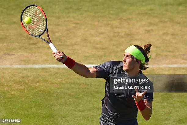 Slovakia's Lukas Lacko returns to Italy's Marco Cecchinato during their men's singles semi-final match at the ATP Nature Valley International tennis...