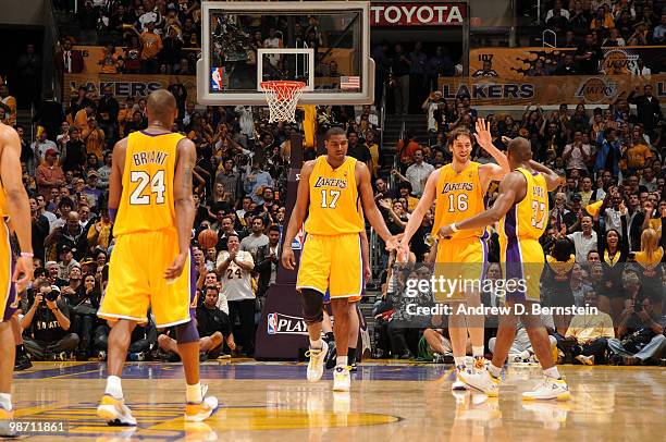 Andrew Bynum, Pau Gasol, and Ron Artest of the Los Angeles Lakers come together during a game against the Oklahoma City Thunder in Game Five of the...