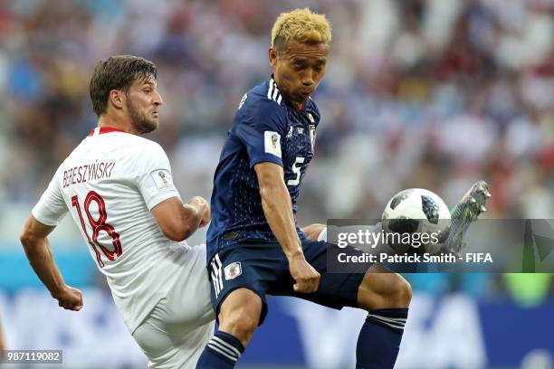 Yuto Nagatomo of Japan and Bartosz Bereszynski of Poland battle for the ball during the 2018 FIFA World Cup Russia group H match between Japan and...