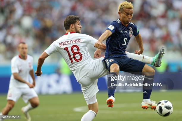 Yuto Nagatomo of Japan and Bartosz Bereszynski of Poland battle for the ball during the 2018 FIFA World Cup Russia group H match between Japan and...