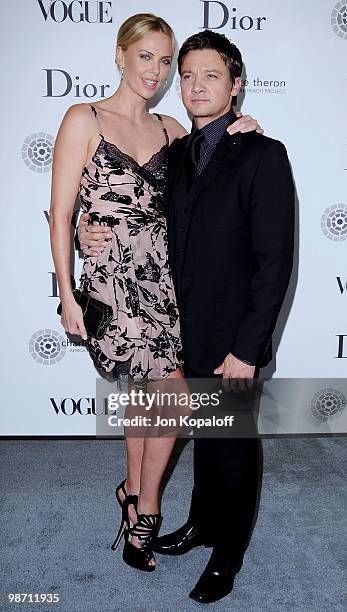 Actress Charlize Theron and actor Jeremy Renner pose at Dior & Vogue Celebrate The Charlize Theron Africa Outreach Project at Soho House on April 27,...