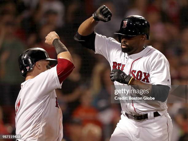 Boston Red Sox center fielder Jackie Bradley Jr. Celebrates with Boston Red Sox catcher Christian Vazquez after his two-run home run in the seventh...