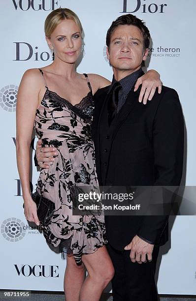 Actress Charlize Theron and actor Jeremy Renner pose at Dior & Vogue Celebrate The Charlize Theron Africa Outreach Project at Soho House on April 27,...