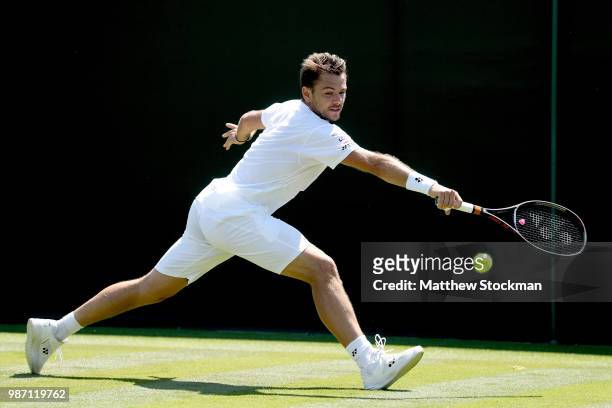 Stan Wawrinka of Switzerland practices on court during training for the Wimbledon Lawn Tennis Championships at the All England Lawn Tennis and...